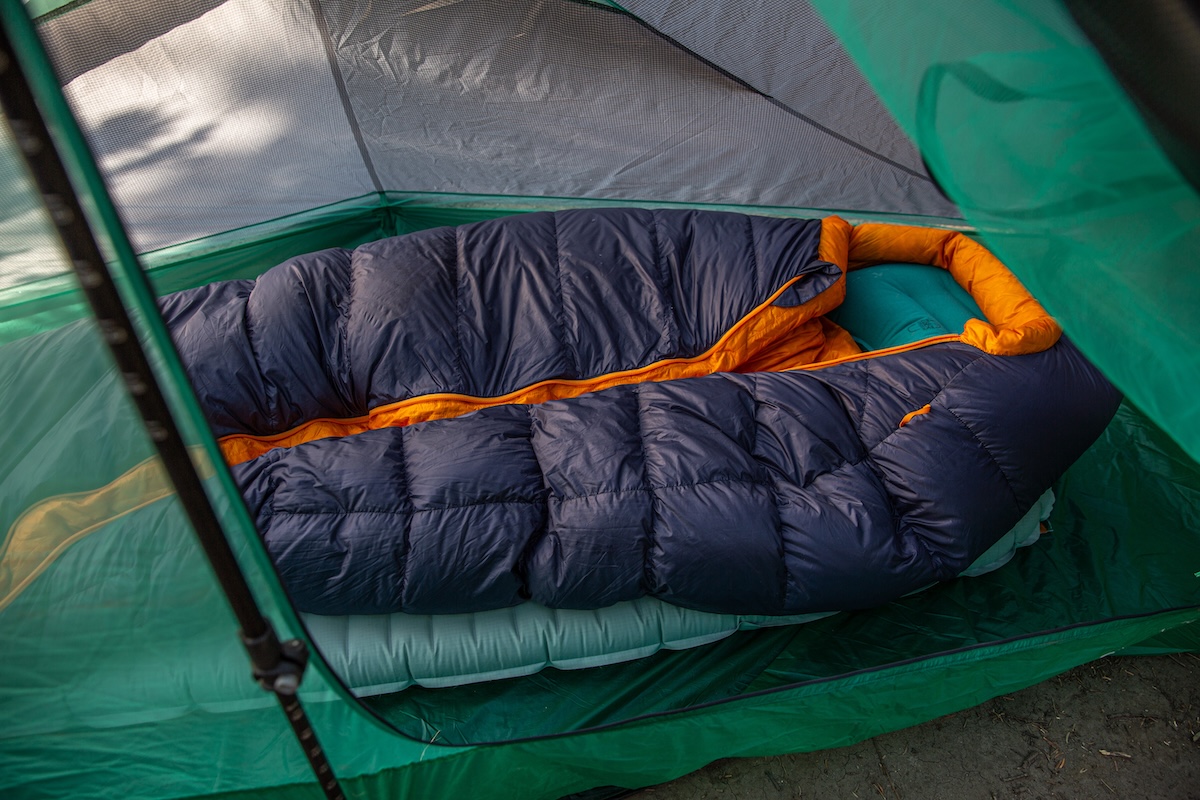 Detailed close-up of the REI Magma sleeping bag fabric and baffling inside a tent.