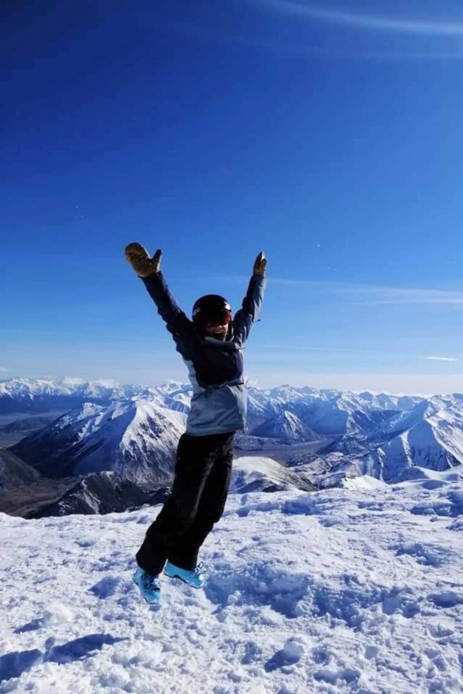 Nicole Montgomery wearing Kinco Pigskin mittens in the snow.
