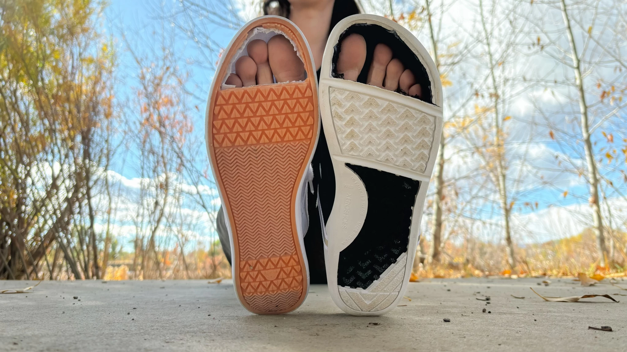Comparison between a traditional narrow shoe and a wide toe box barefoot shoe.