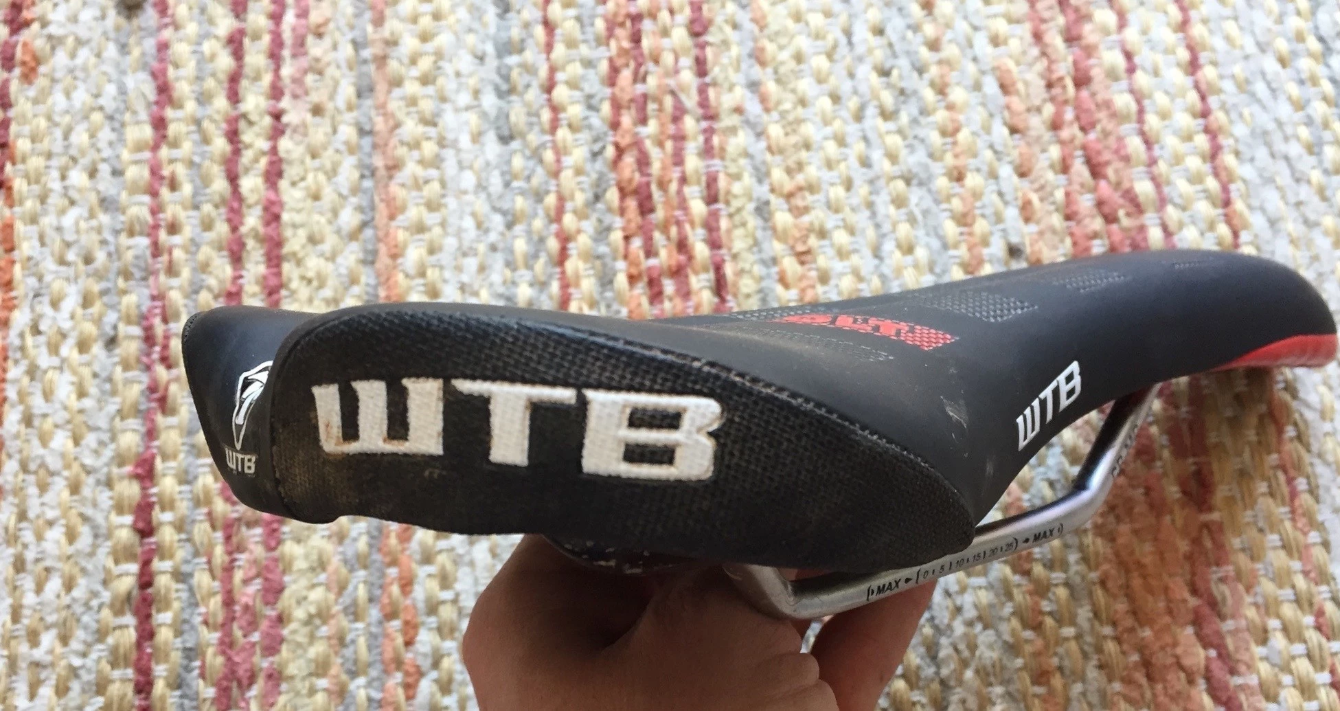 Detailed view of the rear of a WTB Volt saddle highlighting the durable, abrasion-resistant material on the corners.