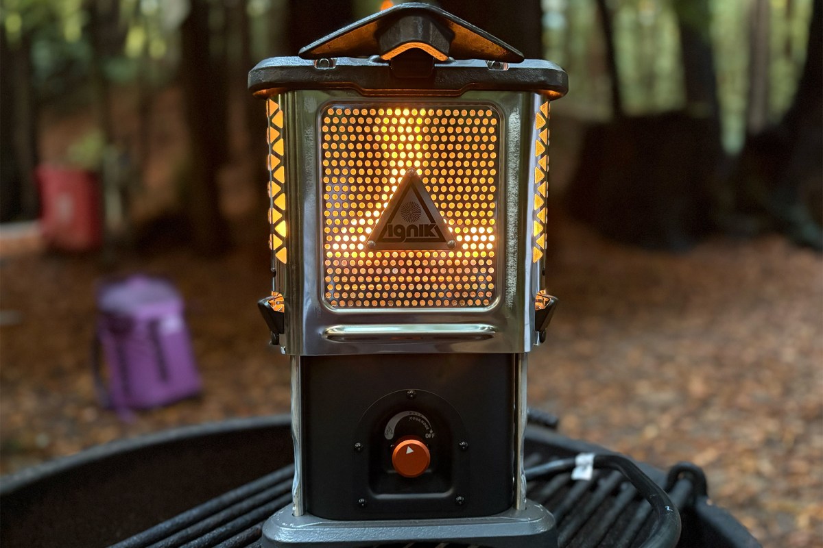 Close-up of Ignik Skullet heater glowing bright orange through the protective front mesh panel.