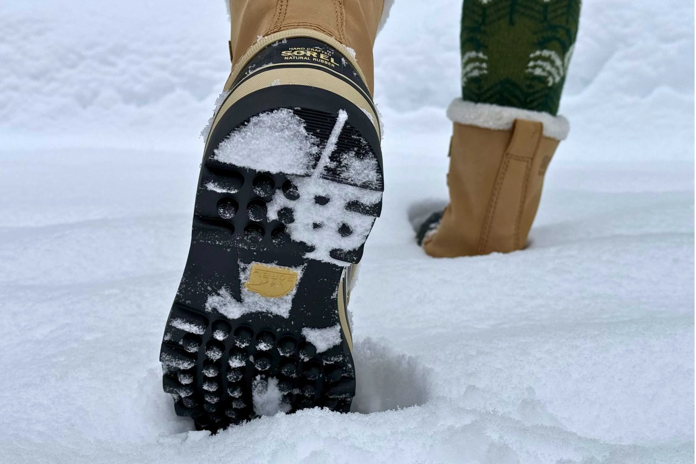 Close-up of the deep, multi-directional lugs on a Sorel Caribou outsole.