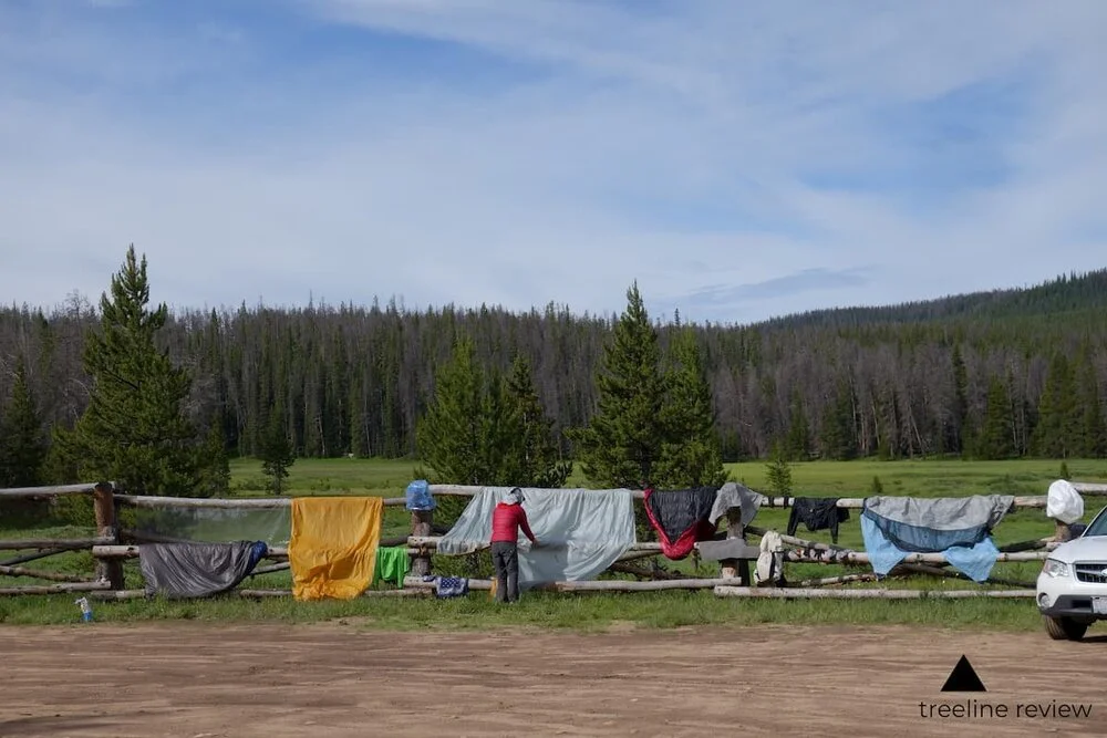 Methodical folding and organization of athletic apparel and outdoor gear.