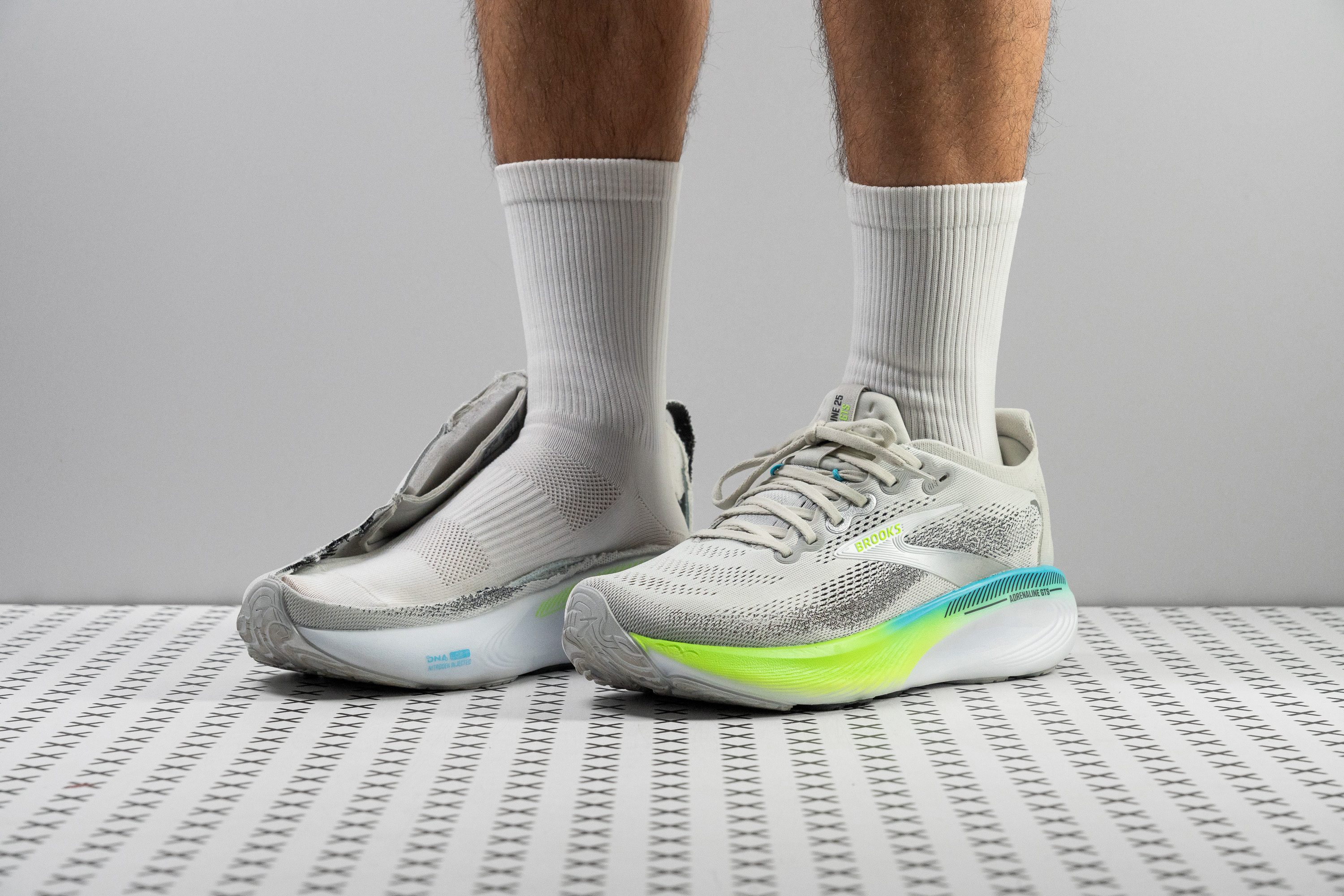 Profile view of a blue and white Brooks Adrenaline GTS 25 stability shoe.