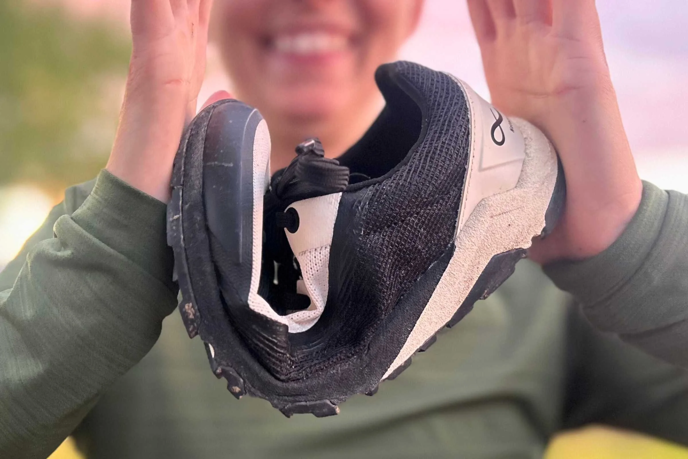 A hand holding the Notace Yama T1 showing its light weight and flexibility.